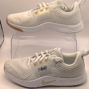 Nike Renew white with gold accents size 8.5